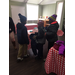 Three children mingling at the Winter Coat Giveaway