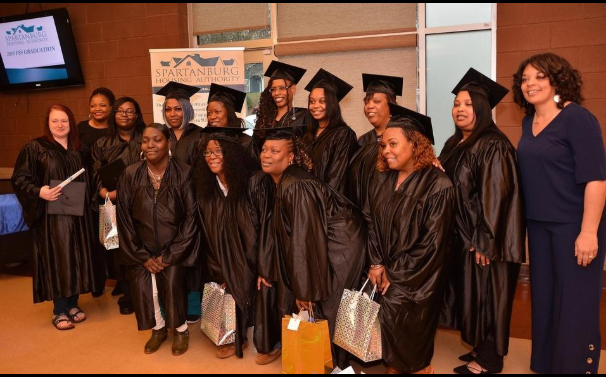 Graduating women posing in a group photo