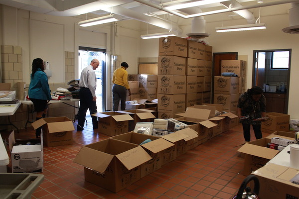A room with boxes of donated goods