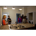 Residents view the kitchen and laundry area