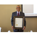 Mr. Byrd holding a framed certificate