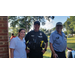 A man and a woman posing with Police Officer Morrow