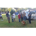 K-9 Police Officer giving a demonstration of his dog to a line of young children