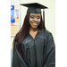 A girl wearing a cap and gown with long straight hair
