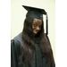 A smiling girl in her cap and gown